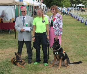 Jennifer recieving an AKC Grant check at a local dog show 2013. Abby and Annecy pictured with her